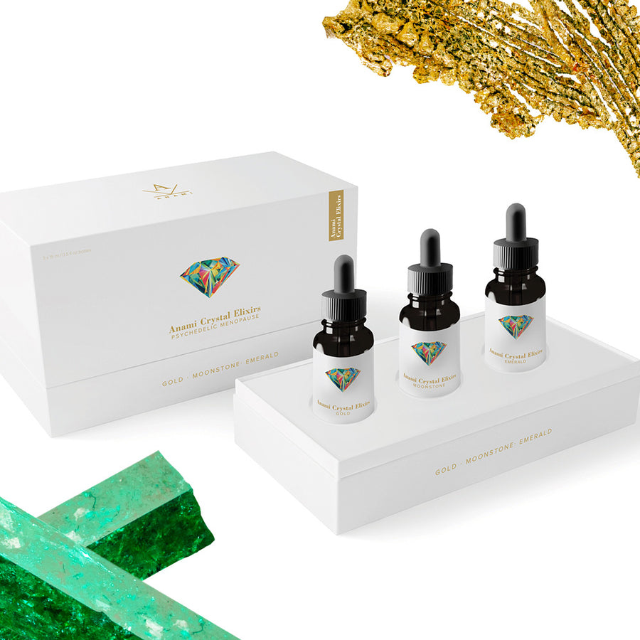 Anami Alchemia Crystal Elixir Psychedelic Menopause collection of three bottles in an open box with elegant branding against a plain white background. 