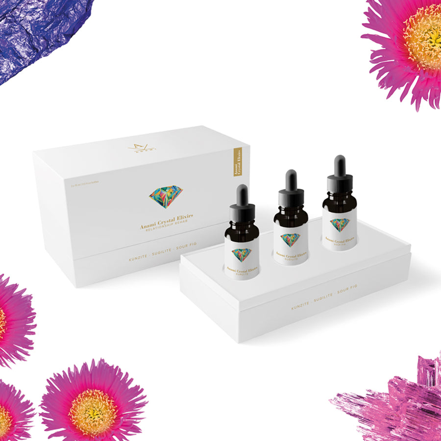 Collection trio of Anami Alchemia's Crystal Elixir, Relationship Rehab displayed in it's chic white packaging, against a plain white background. 