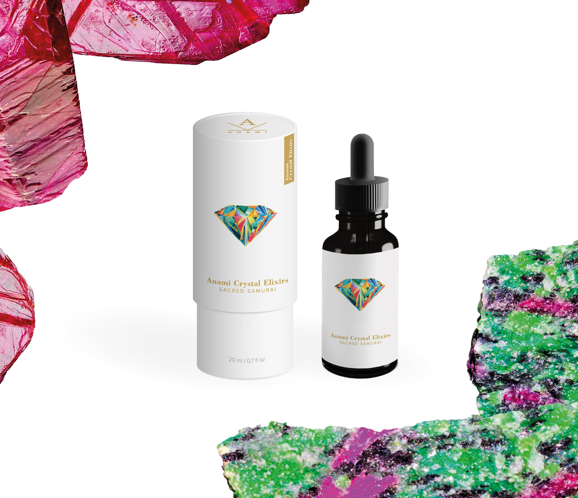 A dropper bottle of Anami Alchemia's Crystal Elixir, Sacred Samurai displayed next to it's cylindrical white packaging, against a plain white background. 
